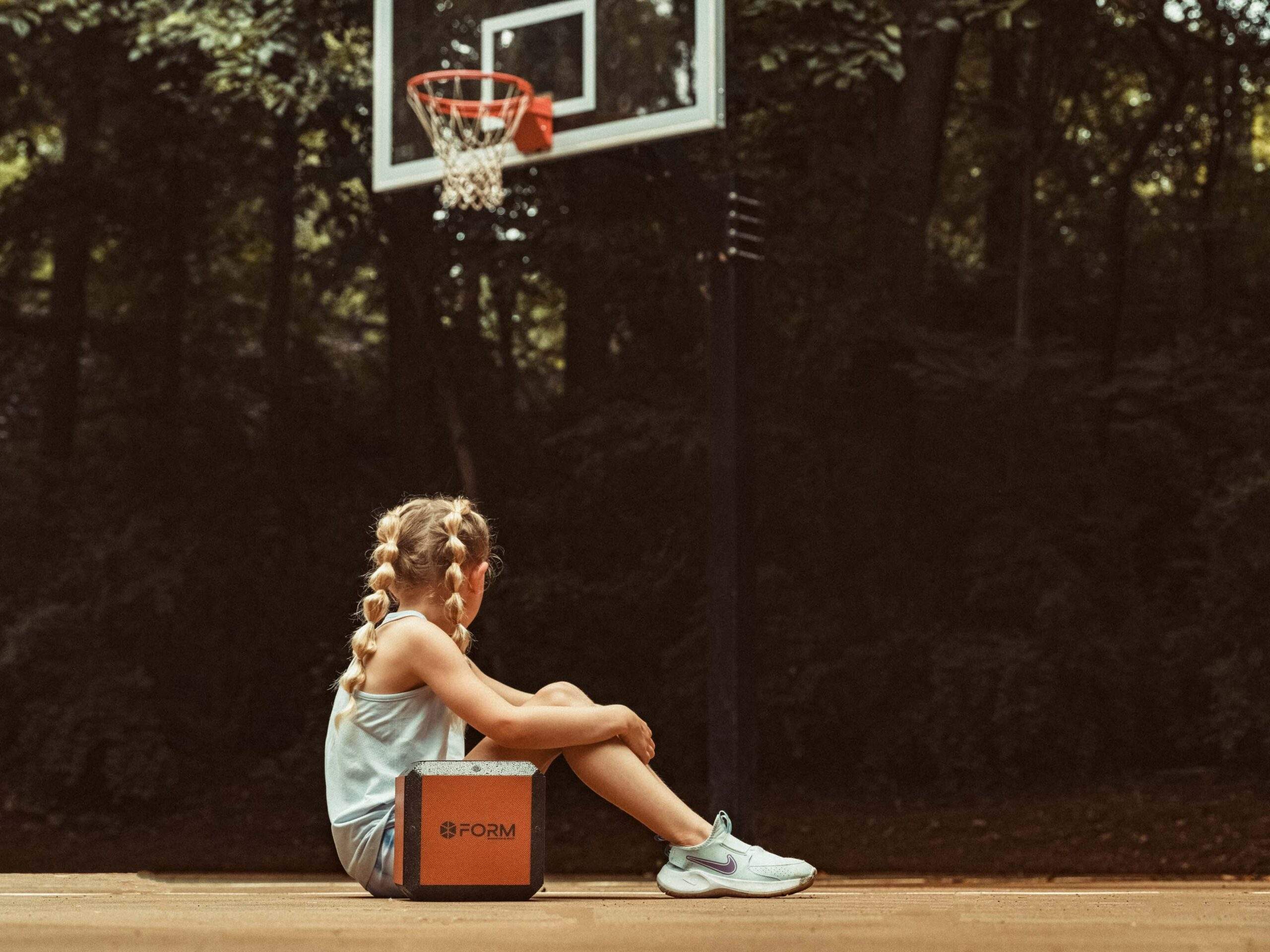 young lady on basketball court